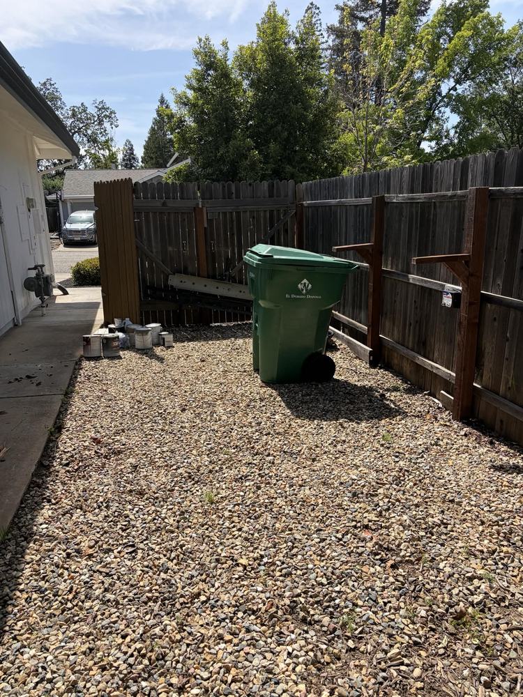 The same side yard cleared back to clean gravel